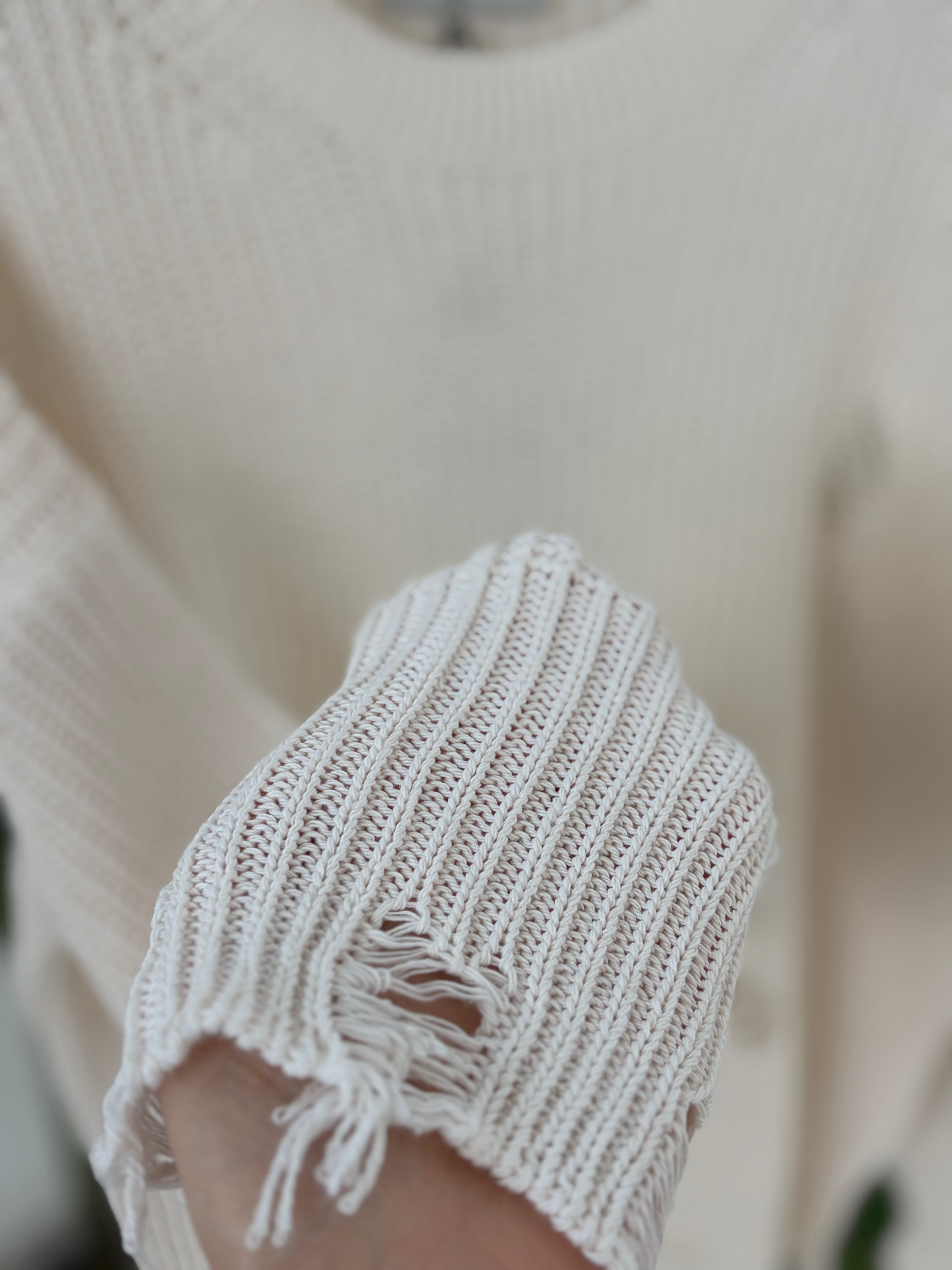Maglia con effetto strappi